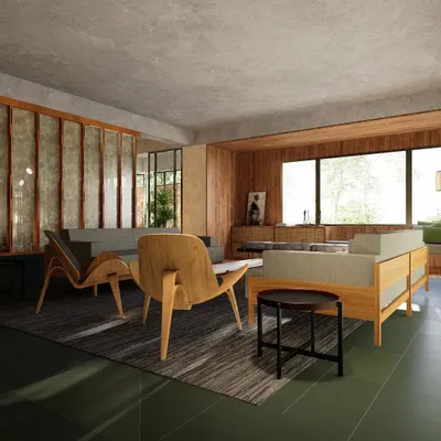The living room of a Gurgaon residence, where we used a palette of natural materials to create a calm and layered space. A partition of wood and cast concrete panels separates zones while allowing light to pass through, complemented by custom-designed wooden furniture.