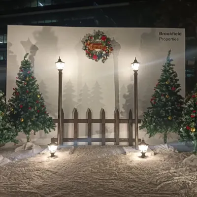 We created this winter wonderland photo booth for Brookfield Properties. The setup includes decorated Christmas trees, old-fashioned street lamps, and a snowy floor, making it a perfect spot for holiday photos.