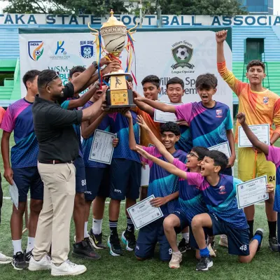 Pure elation! Our U15 team and coaches hoist the championship trophy after a hard-fought season. This victory is a result of their relentless effort and teamwork.