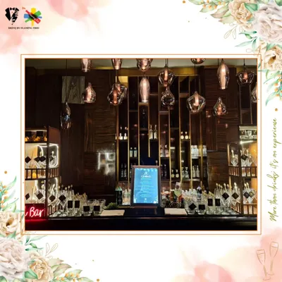 An example of our elegant and modern bar setups. This station, with its sophisticated lighting, mirrored back, and neatly arranged premium spirits, is designed to be a stunning focal point for any event.