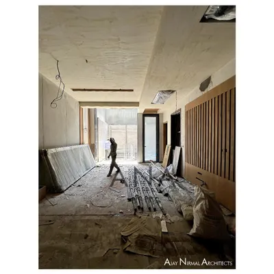 A residence under construction at DLF Phase 1. This image captures the raw volume of the space, with large openings designed to maximize the penetration of natural light and air.