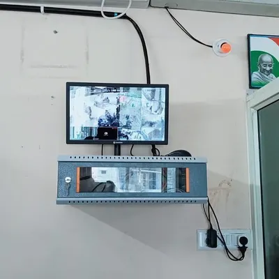 A complete wall-mounted setup with the CCTV monitor and a lockable network rack. This keeps the core of your security system secure and the installation looking clean.