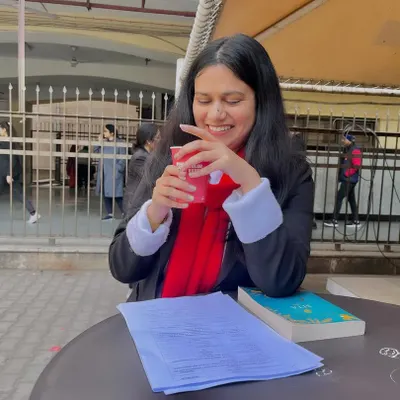 Taking a brief pause with case files at a cafe near the court. Even during breaks, my mind is often on the best way to serve my clients.