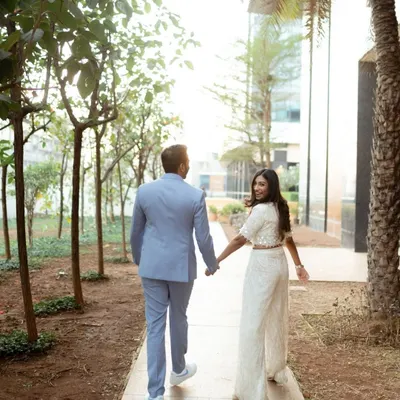 A classic "leading the way" shot from Aayushi and Harshit's Mumbai pre-wedding shoot. Her backward glance and smile create a playful and engaging photo that invites you into their story.