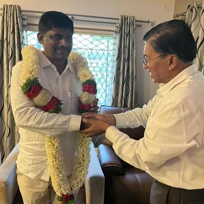 Here, Dr. Shamsunder is in conversation with M.P. D. K. Suresh, who is being honored with a garland. We are humbled to provide our Vaastu and astrology services to influential figures who value our expertise.