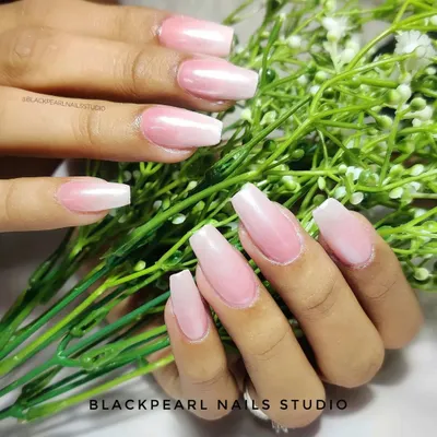 A classic example of the Baby Boomer effect, also known as French Fade. This design features a seamless gradient from a soft pink base to a white tip, creating a timeless and elegant look.