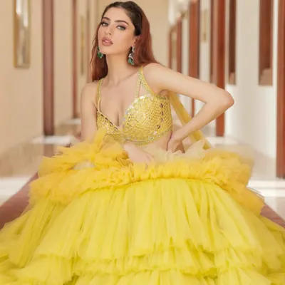 Hello sunshine! This vibrant yellow ruffled lehenga by Liz Paul is the perfect outfit for a Haldi ceremony. It's playful, dramatic, and guaranteed to make you the center of attention.