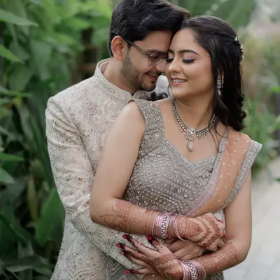 A close-up, intimate portrait capturing the genuine smiles and connection between the couple during their outdoor engagement shoot.