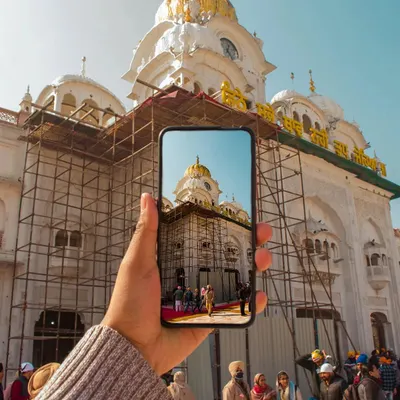 Instead of a typical shot of the Golden Temple, I wanted to try something different. Using a phone to frame the shot creates a picture within a picture, showing how we see and capture these beautiful places today.