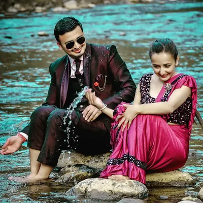 A playful pre-wedding moment by the river. I love using natural elements like water to add a fun and dynamic feel to your couple photoshoot.