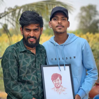 A proud moment presenting my artwork to singer Hanumanthanna. It's an honor to have my art appreciated by artists I admire.
