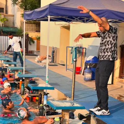 Action-oriented learning with an Olympian. Virdhawal Khade demonstrates the precise body posture and arm positioning for a powerful racing start, giving our swimmers a visual and practical lesson in elite technique.