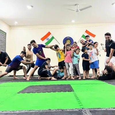 This is what our team is all about. We keep it playful, we keep it real. This photo captures the fun, chaotic, and supportive energy that makes our academy a special place.