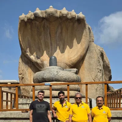The iconic Naga Linga at Lepakshi serves as a stunning backdrop for our group photo. This monolithic sculpture is a highlight of our heritage ride to Andhra Pradesh.