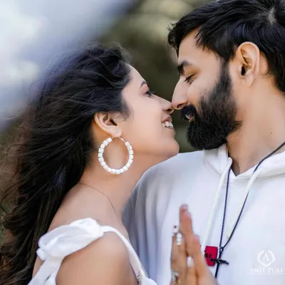 A perfect, joyful close-up that captures the pure happiness of being together. The wind in her hair and their natural smiles make this a beautiful, candid moment of love.