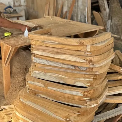 A stack of solid wood components, shaped and joined by hand in my workshop. This is the starting point for many of my custom chair designs.