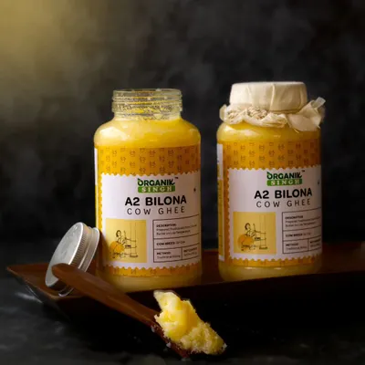 The rich, granular texture of A2 Bilona Cow Ghee is the focus of this dark and moody shot. I used dramatic lighting to create a sense of tradition and purity, highlighting the golden color of the ghee.