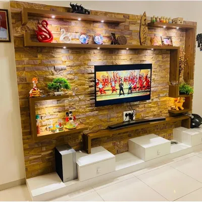 This is our approach to creating a stunning focal point in your living room. We used a floor-to-ceiling stone-cladding effect, integrated with custom shelving and warm ambient lighting, to build a TV unit that is both a media center and a piece of art.