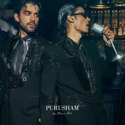 The night comes alive in the details. This look features a black suit with sequined lapels and shoulders, designed for the man at the center of the celebration. It's about sharp tailoring that feels both classic and completely of the moment.