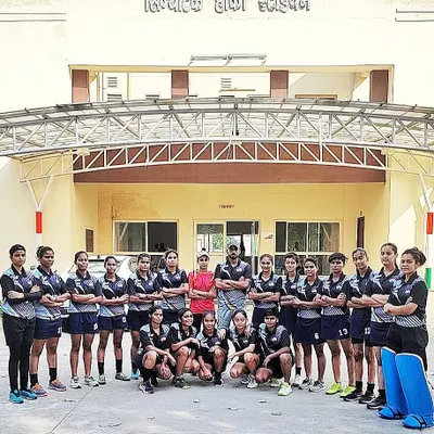 My Salute Hockey Academy U-16 girls' team posing at the Shivalik Hockey Stadium in Lucknow. Their confidence and unity are visible as they prepare for the Khelo India league.