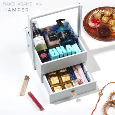 My Rakshabandhan Hamper, designed to celebrate the bond between siblings. This beautiful two-tiered gift box includes a selection of my organic handmade skincare, along with traditional sweets and a rakhi.