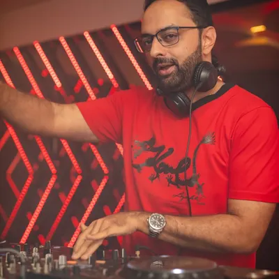Focused on the mix during a Blockbuster Saturday night. Every transition and beat drop is crafted to keep the energy flowing.