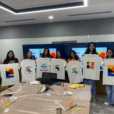 A fantastic group of new artists from Arcesium showing off their hand-painted t-shirts. My corporate art workshops are a great way to encourage team bonding and creative expression.