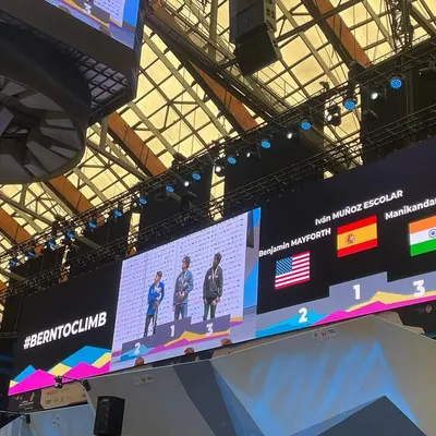 A wide shot of the podium at the IFSC World Championship in Bern. Seeing the Indian flag on the big screen next to my name was an unforgettable moment of pride.