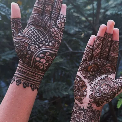 This design perfectly captures the Indo-Arabic style, with a bold, cuff-like pattern on one hand and a more delicate, floral mandala on the other. It's a unique and contemporary choice.