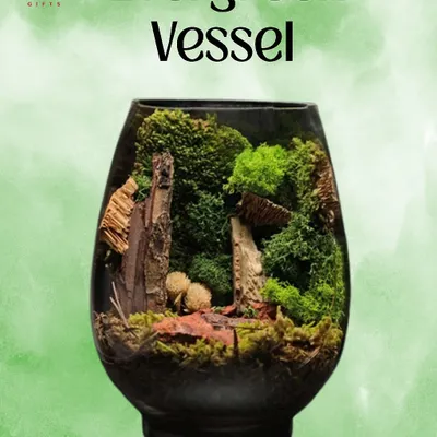 The 'Evergreen Vessel' terrarium. This elegant, egg-shaped glass contains a miniature forest scene, a timeless gift that stays green forever.
