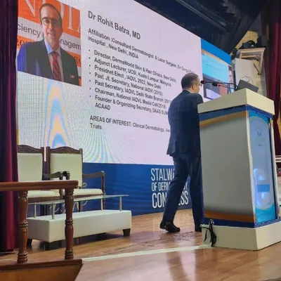Here I am delivering a talk to fellow dermatologists on the protocols and latest technologies for laser hair removal. It is crucial to use the right technology and settings for different skin and hair types to ensure a safe procedure with the best possible outcome. I share my clinical experience to help guide budding dermatologists.