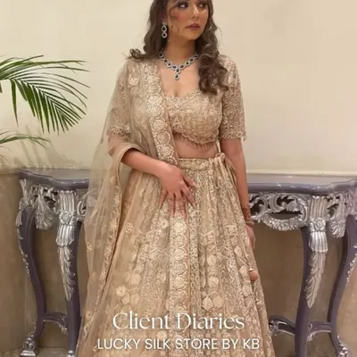 Client Diaries: A stunning client looking absolutely ethereal in a custom gold lehenga for her special event. Her smile says it all!