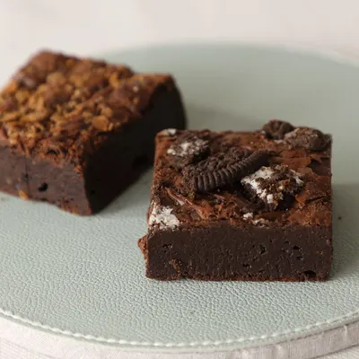 Fudgy, gooey, and irresistible. Here are two of my most popular brownie varieties: the Creamy Oreo Brownie and the Nutella Hazelnut Brownie.
