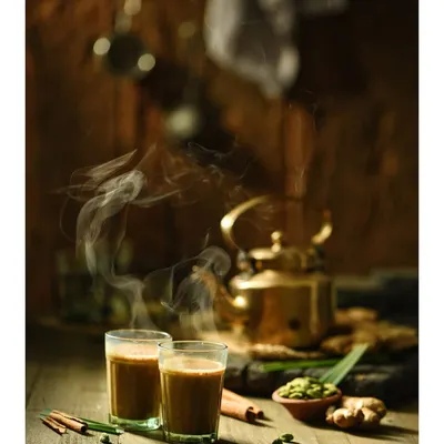 This is a classic still life food photograph. I used dark, moody lighting and captured the rising steam to create a warm, inviting atmosphere that evokes the comfort of Indian chai.