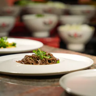 A beautifully plated dish of soba noodles, prepared for a corporate luncheon. This light and healthy option is both flavourful and elegant.