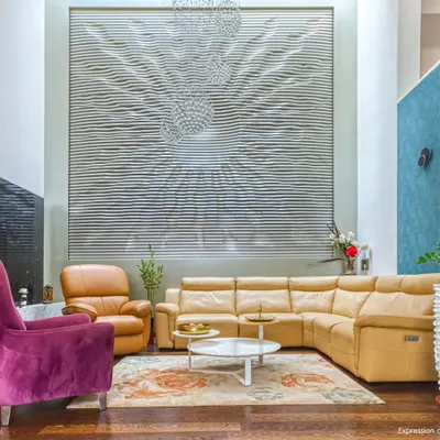 For "A Home by the Park," we created this double-height living room featuring a massive, custom-designed art installation. The piece becomes the focal point, reflecting light and adding texture to the space.