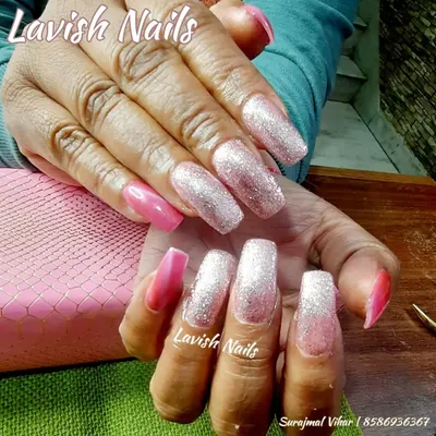 Extra-long square nails showcasing a dramatic pink and silver glitter ombré effect, perfect for a high-glamour bridal or reception look.