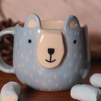 A cute, hand-painted bear mug from my 'Paw-try' collection, perfect for a cozy cup of hot chocolate with marshmallows. Each piece is designed to bring a little joy to your day.