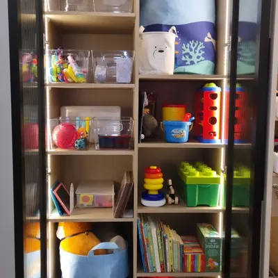 The more visible and colorful a kid's setup is, the more they'll use it. We kept easy-to-use toys on lower shelves for independent play and toys requiring supervision up higher.