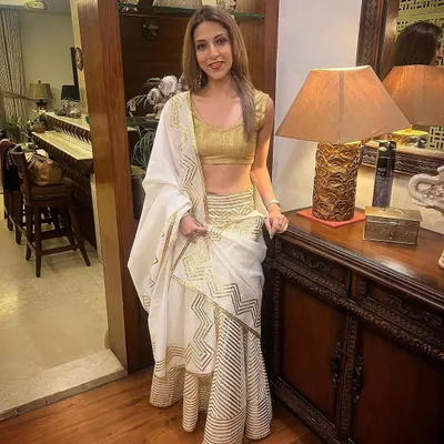 I love dressing up for the festive season. This white and gold ruffled saree is one of my favourites for a modern yet traditional look.