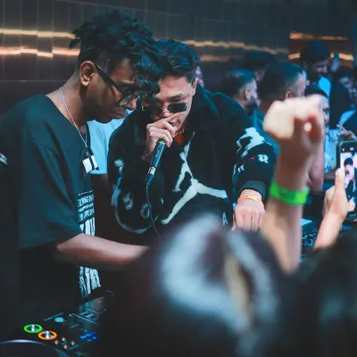 Sharing the mic with an artist during a packed club night. My sets are interactive, bringing the hype and working with performers to create a live, dynamic experience.