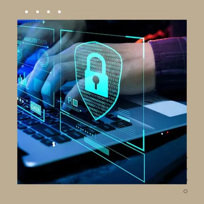 A visual of hands on a laptop with a digital security shield overlay. This represents the robust, cyber-secure foundation of KNX systems, ensuring your smart home network is protected from external threats.