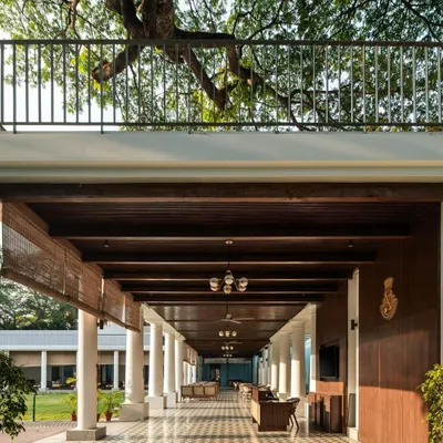 The new colonnade at the Bangalore Club provides a sweeping, sheltered view of the main lawn. I used a timber-clad roof and heritage-patterned tiles to ensure the addition felt like a natural extension of the club's historic architecture.