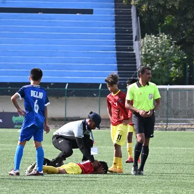 In the heat of the moment, immediate care is crucial. Here I am providing on-field first aid to a young football player during a match, ensuring a swift and professional response to a sports injury.