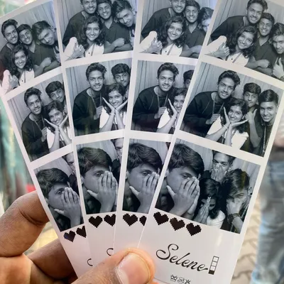 A handful of classic black and white photo strips with a simple heart border. This timeless design is always a favorite, focusing on the fun poses and expressions.