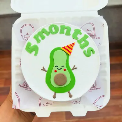 The cutest avocado cake for a 5-month celebration. This little guy is made from fondant and is perfect for marking monthly milestones.