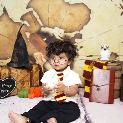Ready for Hogwarts! This little wizard, complete with glasses and a tie, is all set for his Harry Potter themed sitter session.