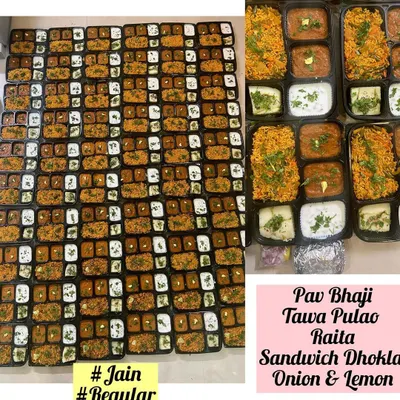 A large order of individually packed meals, featuring both Jain and regular options. Each box contained Pav Bhaji, Tawa Pulao, Raita, and Sandwich Dhokla for a convenient and complete meal.