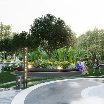 A view of the 'Flower Garden' at a Sattva Group project, featuring a circular bench integrated into a raised planter. This space is designed as a social hub, with curved pathways and layered plantings creating a soft, organic feel for residents to gather and relax.