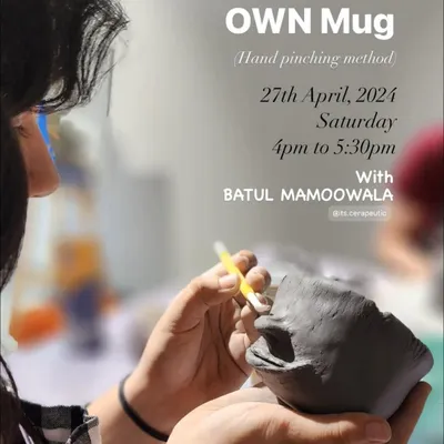 Our "Make Your Own Mug" workshop is a great place to start your pottery journey. This poster captures a moment of focus as a participant sculpts a face onto their hand-pinched mug.